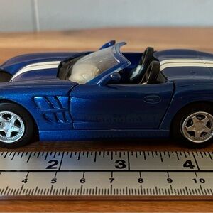 1/32 SHELBY SERIES 1 BLUE WITH WITH WHITE STRIPE NEW RAY DIECAST MODEL CAR